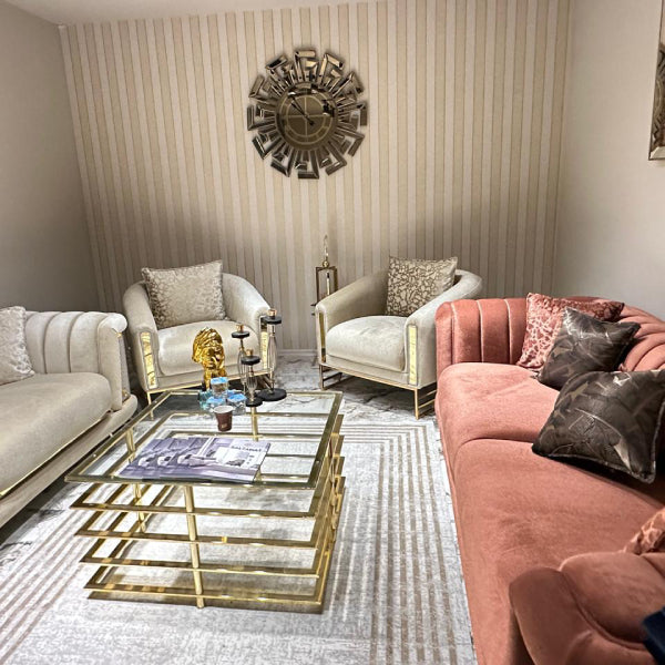 Sumptuous Sofa: Plush upholstery with elegant gold accents