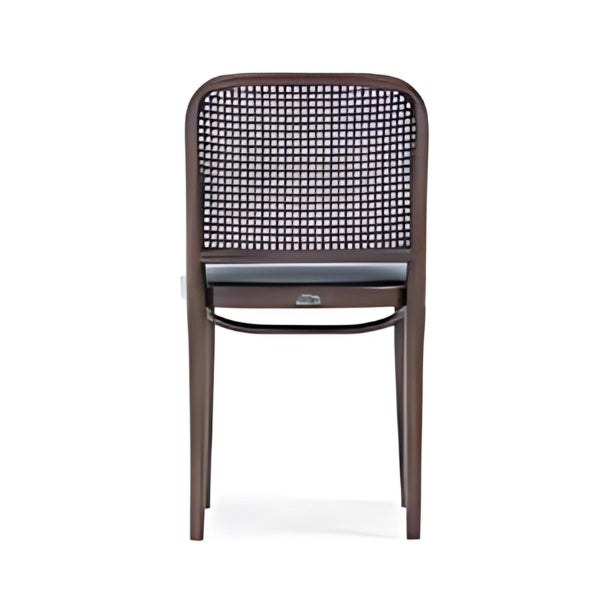 Elegant Black Upholstered Chair with Rattan Back and Dark Wood Frame